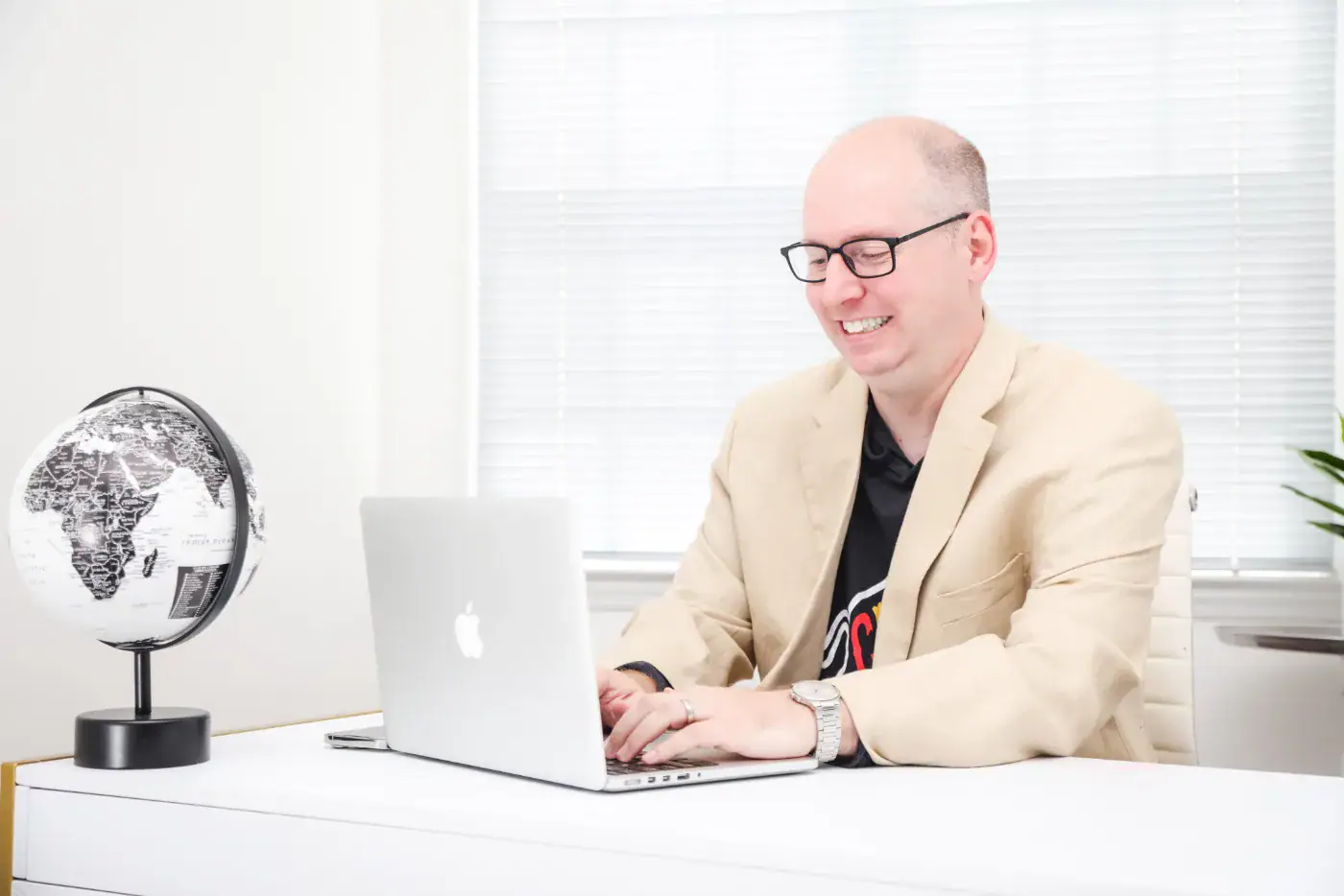 Jeremy Simpson working on a website at his laptop in the Bull City Web Design office